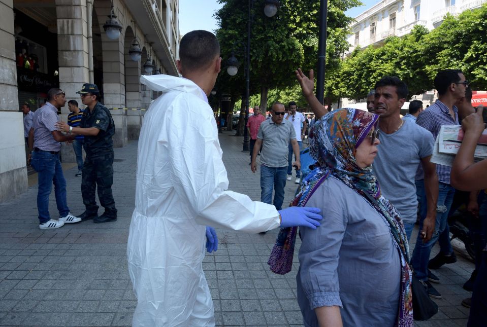  A forensics officer near the arcade with the first blast happened