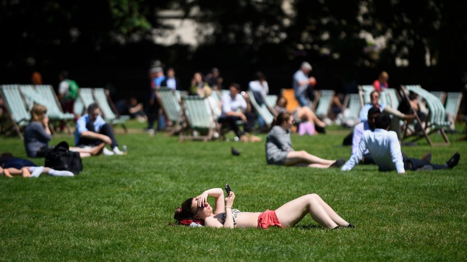 Londoners enjoy a warm afternoon in Green Park