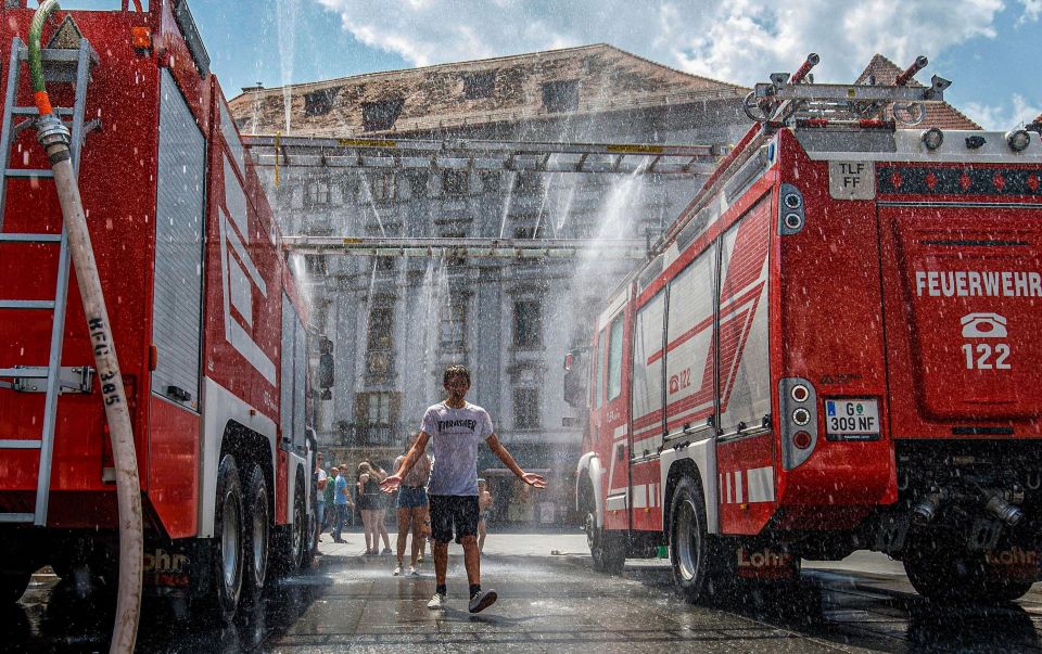  Firemen construct a water wall for people in Graz, Austria