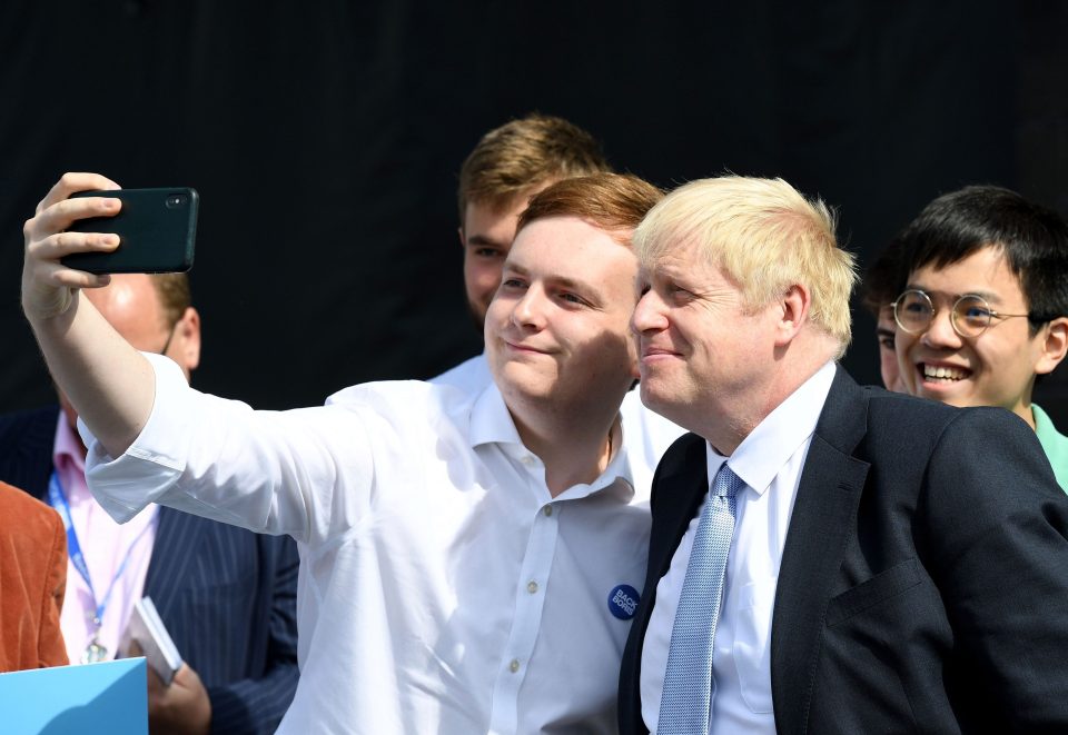  Boris taking a selfie with a young fan