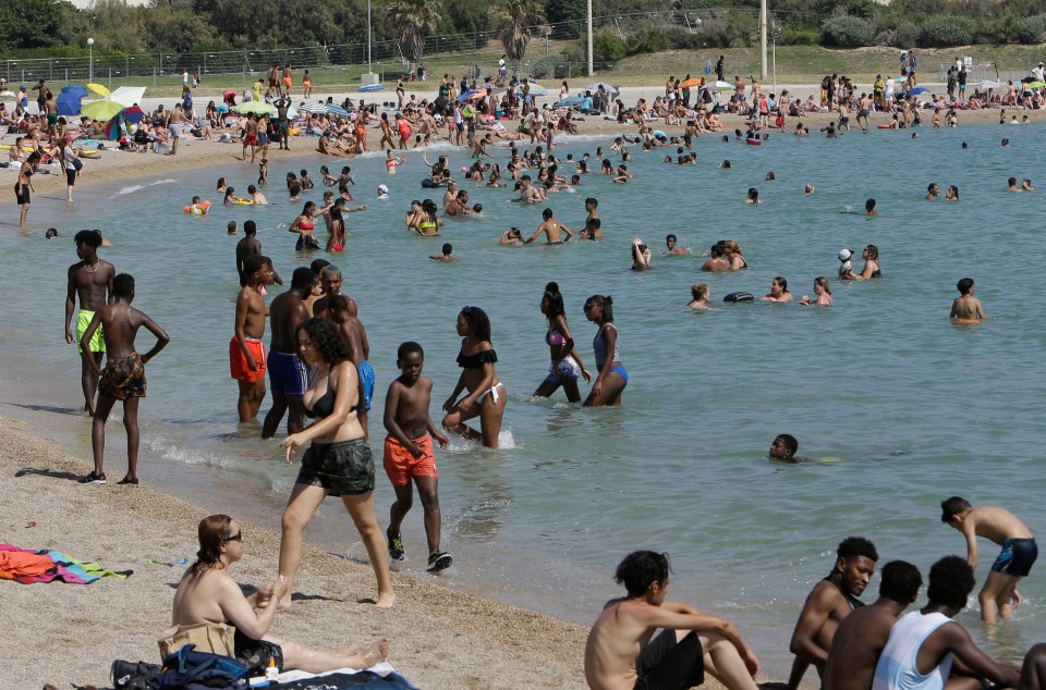  People enjoy the Mediterranean Sea on Friday, June 28, 2019 on the beach in Marseille, southern France