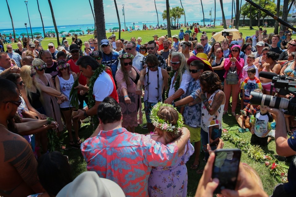 Duane with mourners during a ritual at the memorial in Hawaii