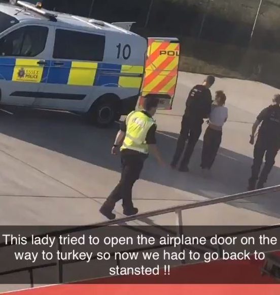 A woman was escorted off a Jet2 flight by authorities after allegedly 'storming the cockpit'