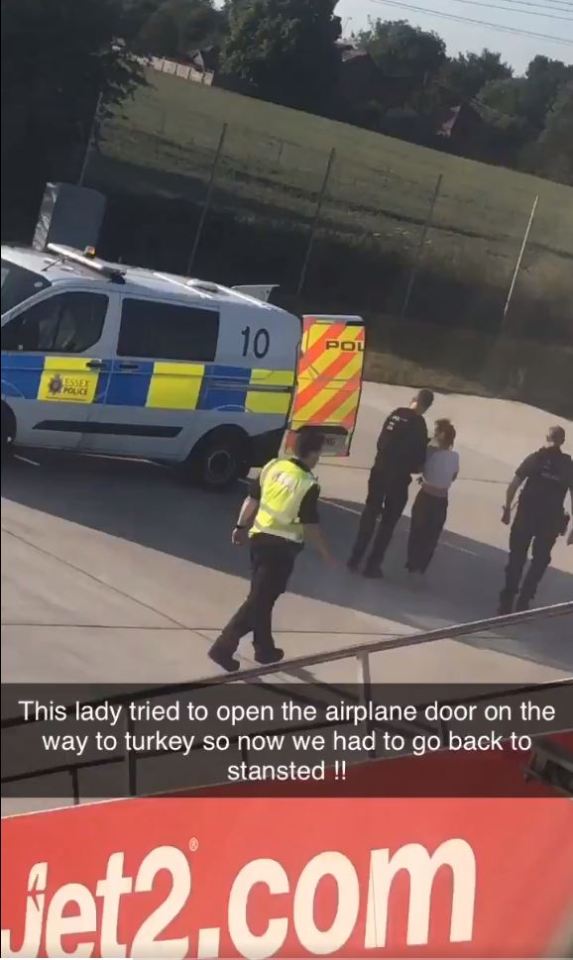 A woman was escorted off a Jet2 flight by authorities after allegedly 'storming the cockpit'