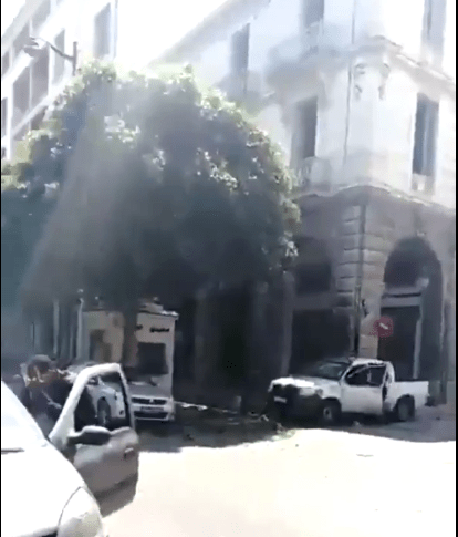  The scene of the first attack, with the damaged vehicle, seen from the corner of Charles de Gaulle Street