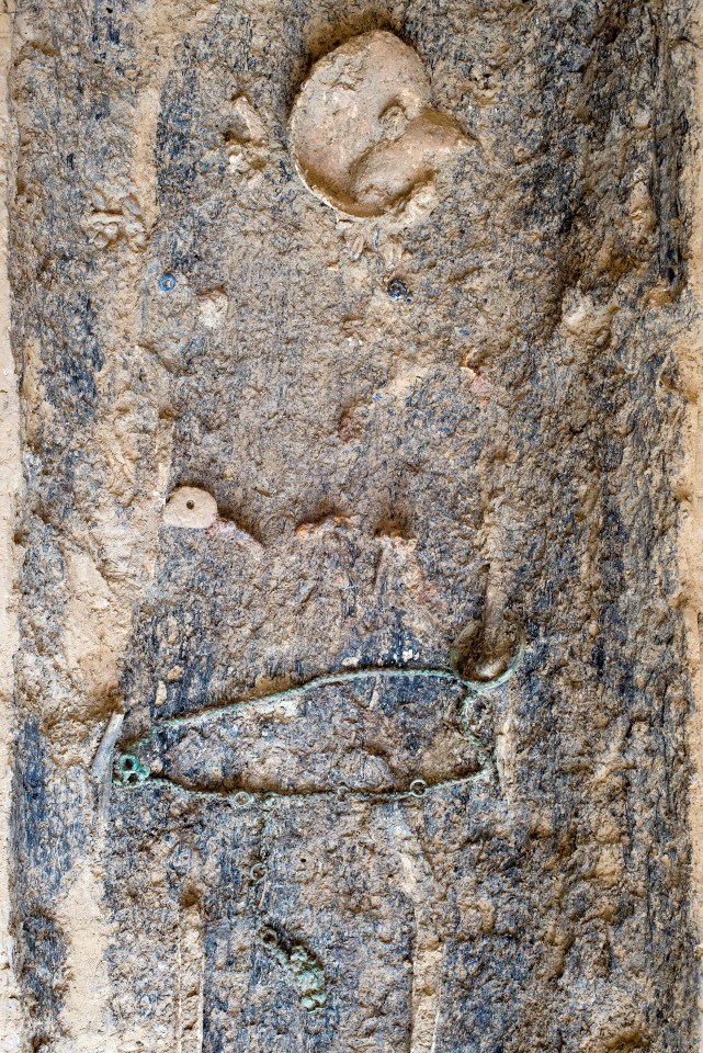  The ancient corpse of a woman buried in a hollowed out tree in Zurich, Switzerland. Pictured are parts of her remains including her skull (top), as well as her jewellery (blue, bottom)