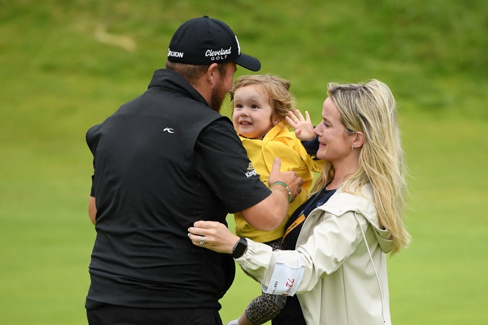  The Irishman celebrates with wife Wendy and daughter Iris after smashing the field by six shots