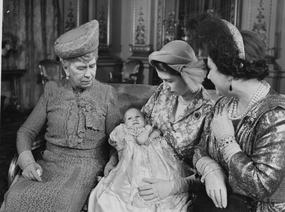  Queen Elizabeth holding Princess Anne after her christening in 1950