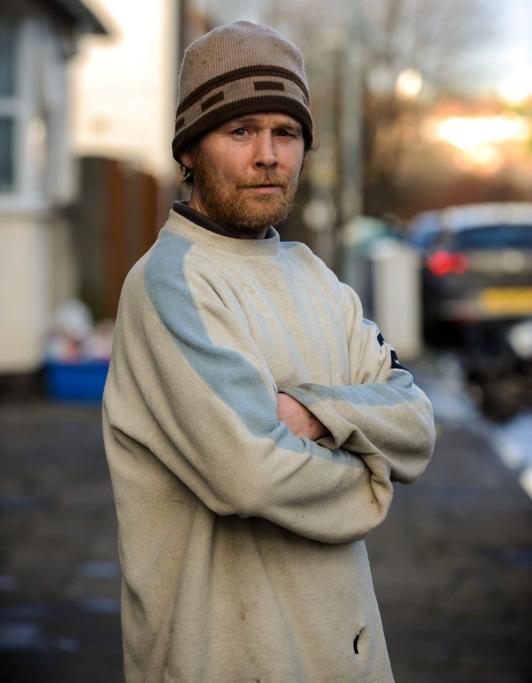 Fungi stands outside his home on James Turner Street in 2014