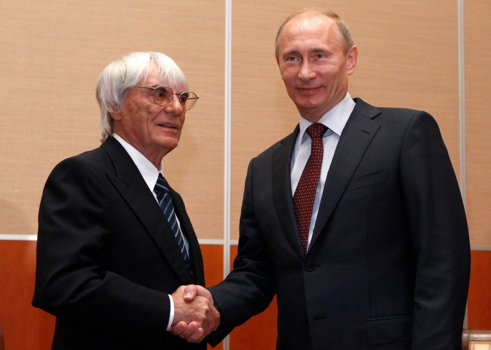  The Formula One boss shaking hands with the Russian leader