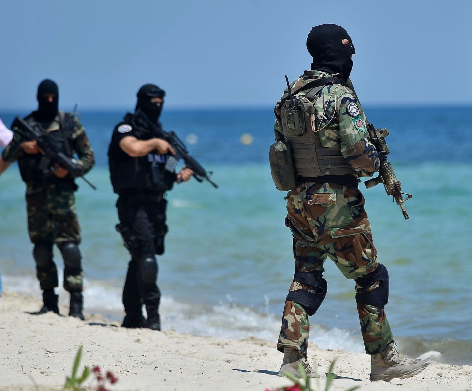  Police patrol the beach at Sousse, Tunisia, following a terrorist attack in 2015