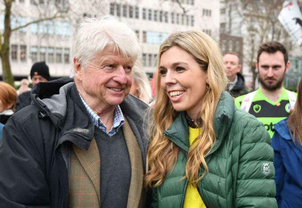  Some fear environmental campaigner Carrie may influence policy - seen here with Boris' father at a rally