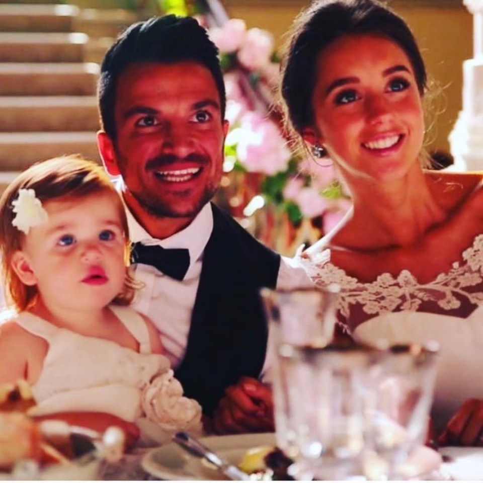  Emily and Peter on their wedding day with daughter Millie