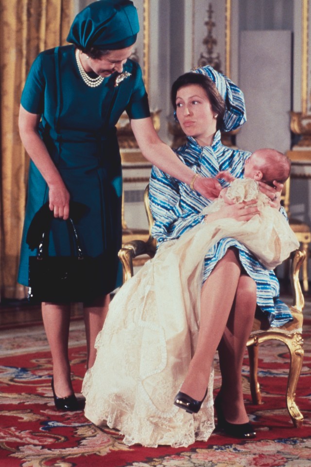  Princess Anne comforts son Peter Phillips after his christening in 1977