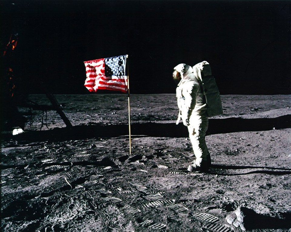  US astronaut Buzz Aldrin standing by the US flag planted on the surface of the Moon on July 20, 1969