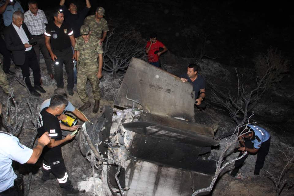  Turkish Cypriot police and officials check the remains of what officials said was a suspected Russian missile