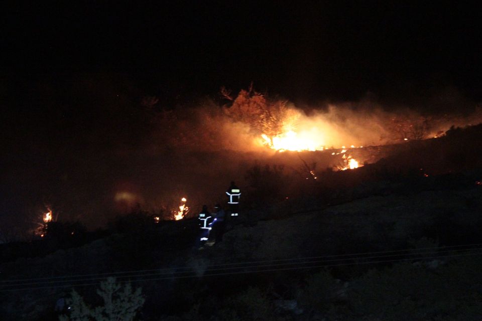  Fire burning on a hillside where the missile exploded