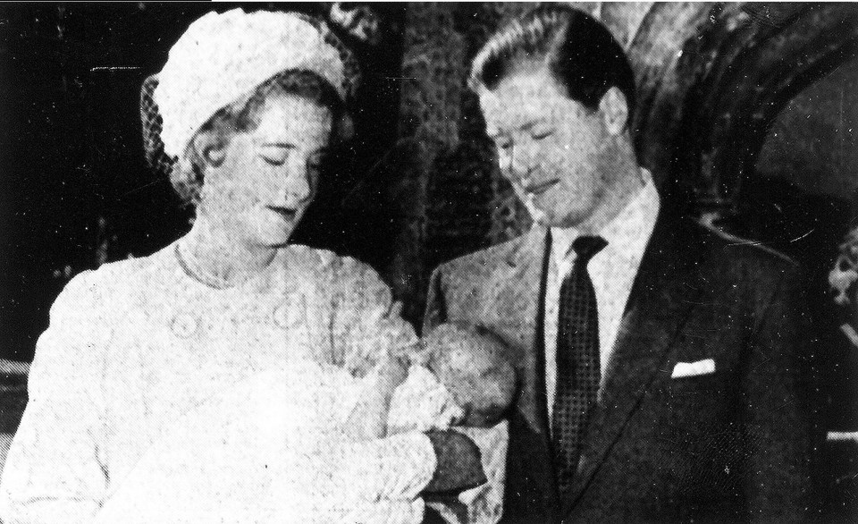  Lord and Lady Althorpe holding Princess Diana outside St Mary Magdalene Church in July 1961