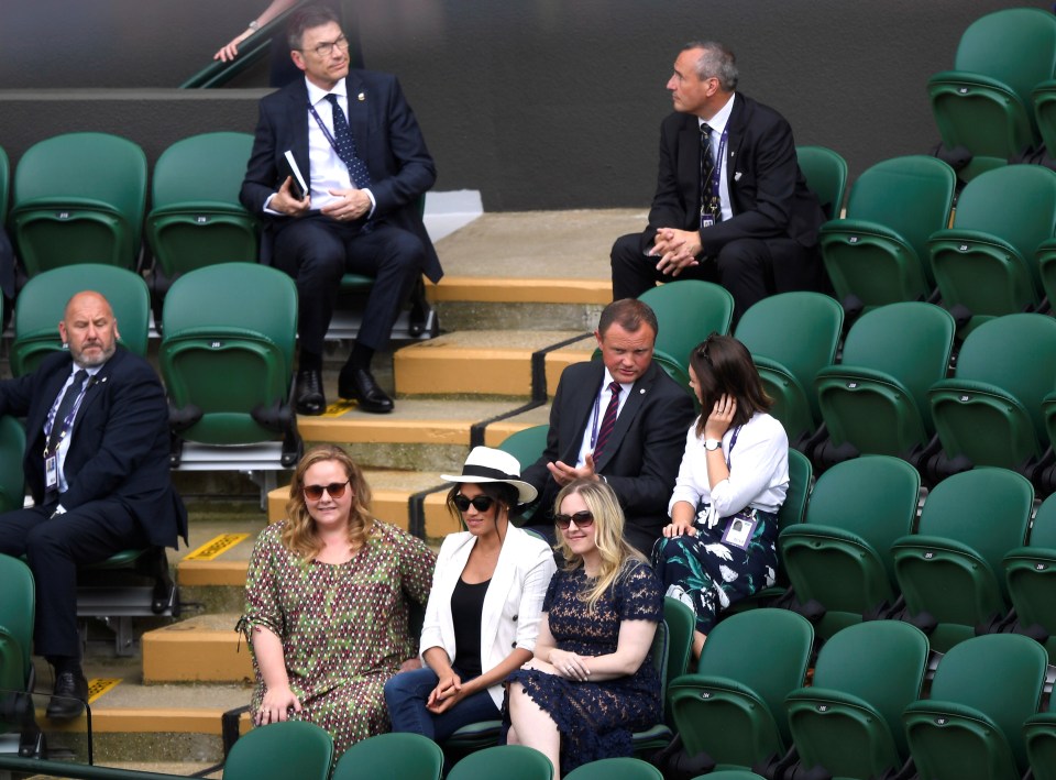  Meghan sat with friends at Wimbledon last week