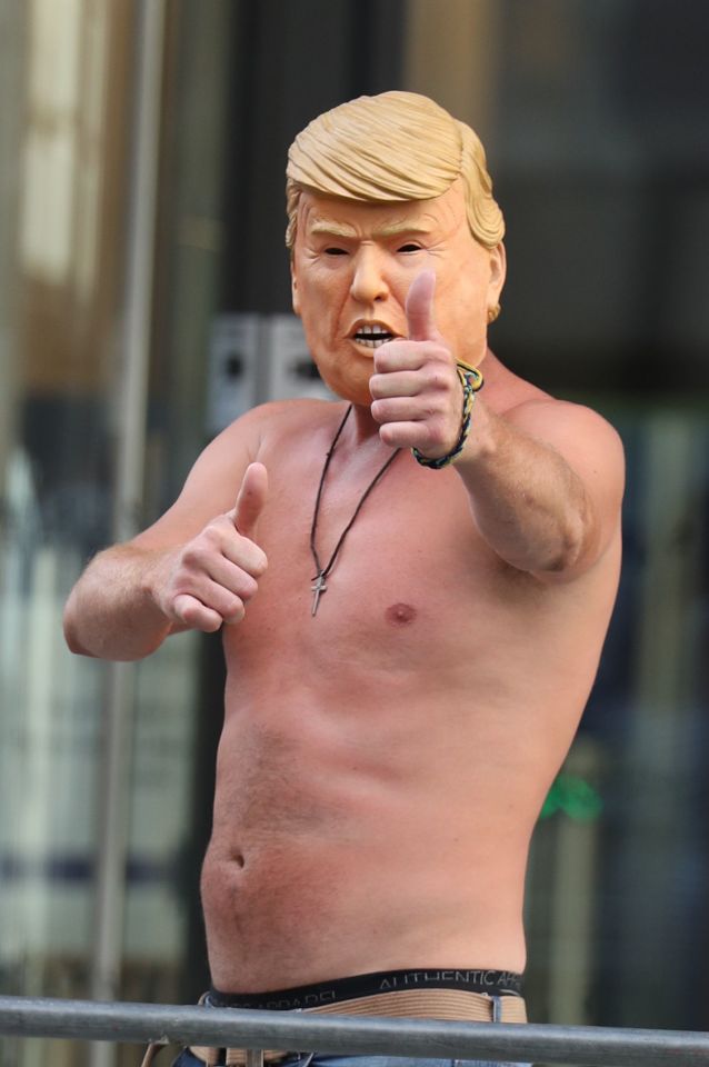  A supporter posed in a bizarre outfit of a bare chest and a Donald Trump mask