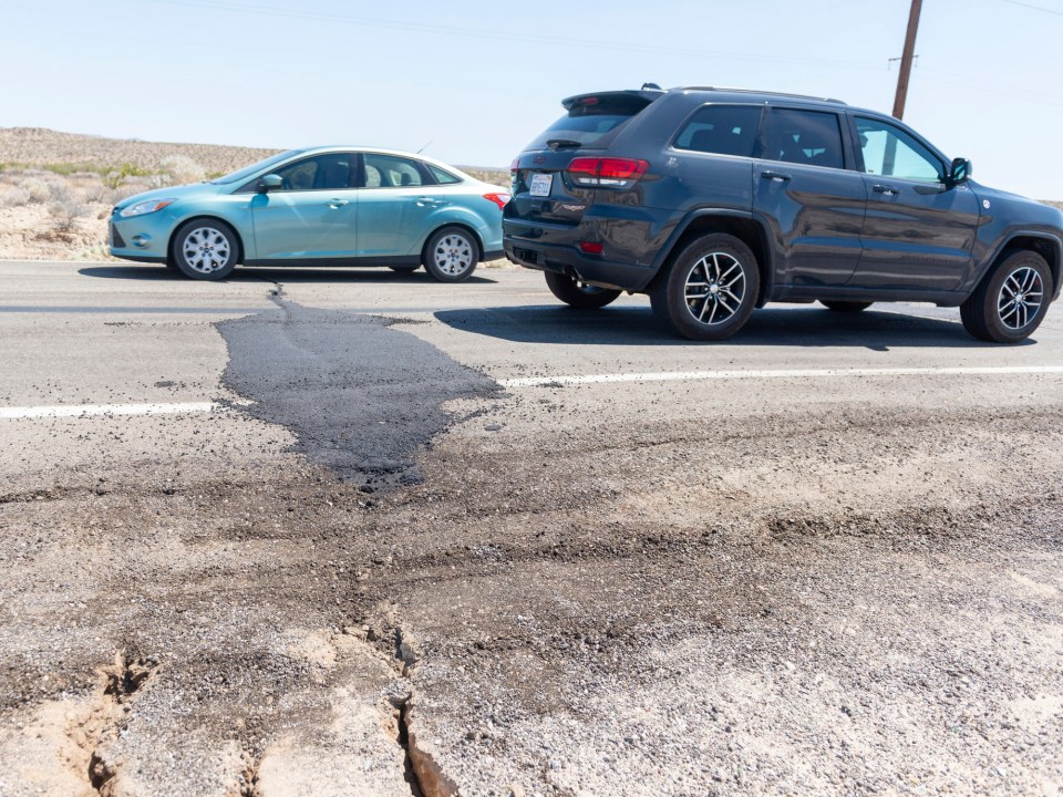 Traffic drives over a patched section of Highway 178 between Ridgecrest and Trona