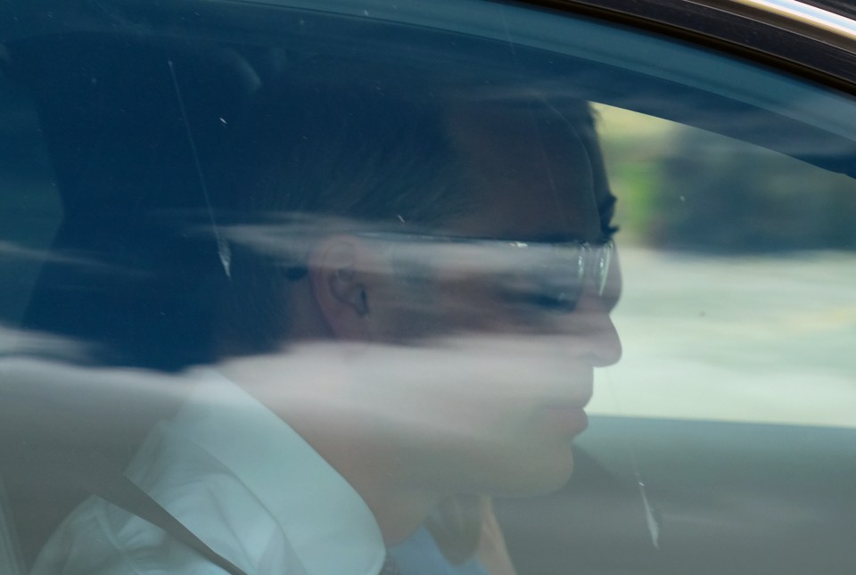 Prince William arrived in dark sunglasses as he drove himself and his wife to the christening in Windsor