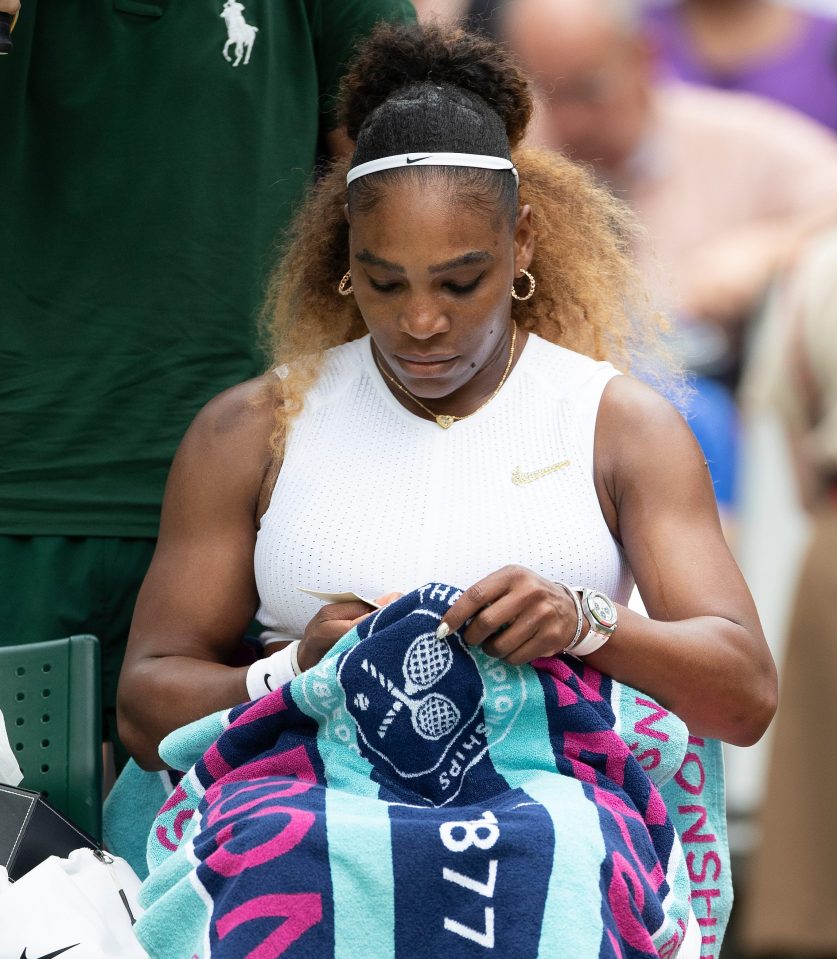 Serena Williams takes a read of one of the notes she wrote herself before her Wimbledon clash with Alison Riske