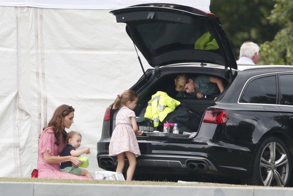 Kate Middleton was seen helping Prince Luis tuck into a snack as George and Charlotte played nearby