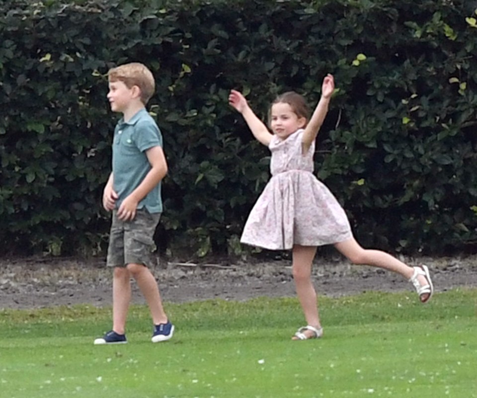 Cheeky Princess Charlotte dances with brother Prince George