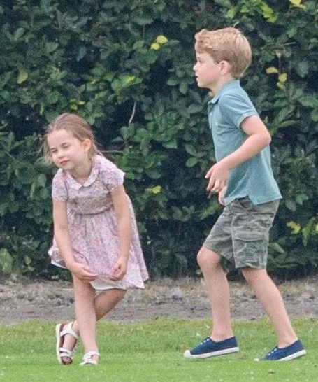 Charlotte wore a sweet pink dress while her big brother George wore a light green shirt