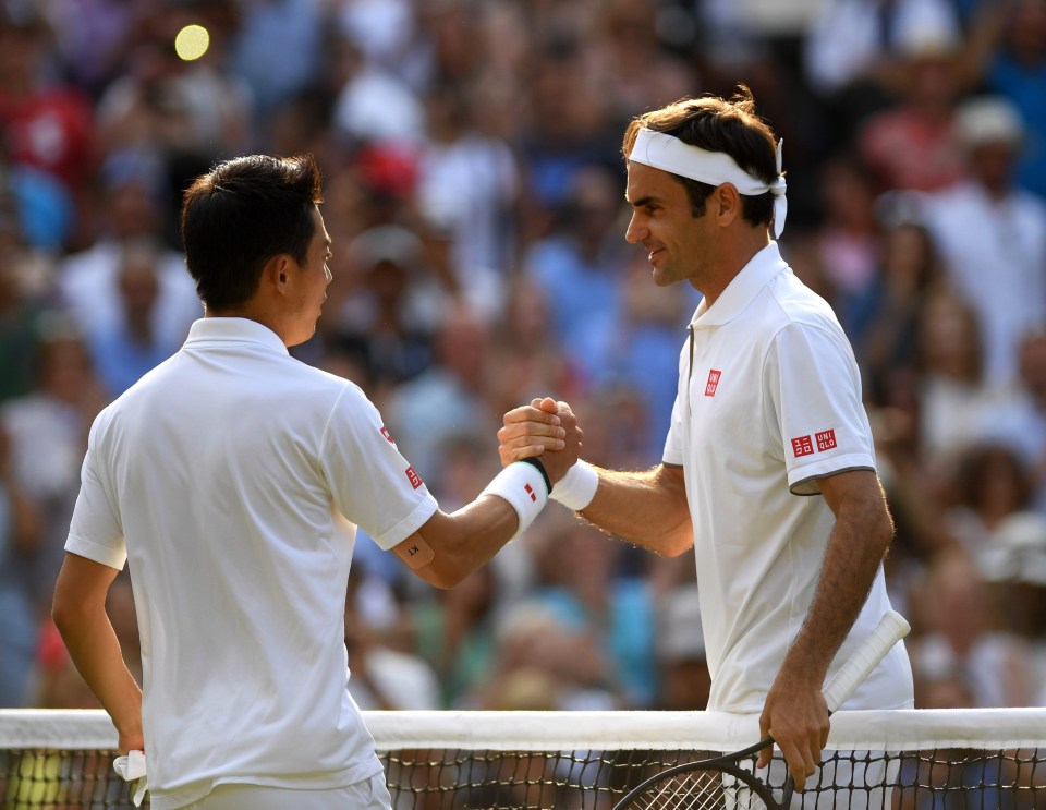 Federer is congratulated by Japans Kei Nishikori after their quarter-final 