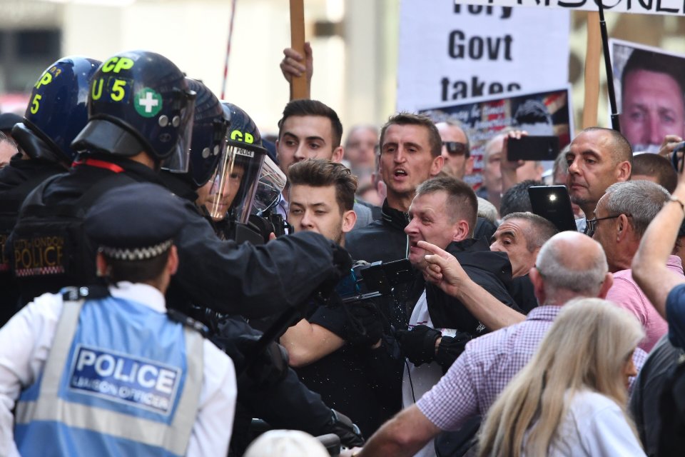 Tommy Robinson fans were furious with the sentencing as they confronted cops outside the court