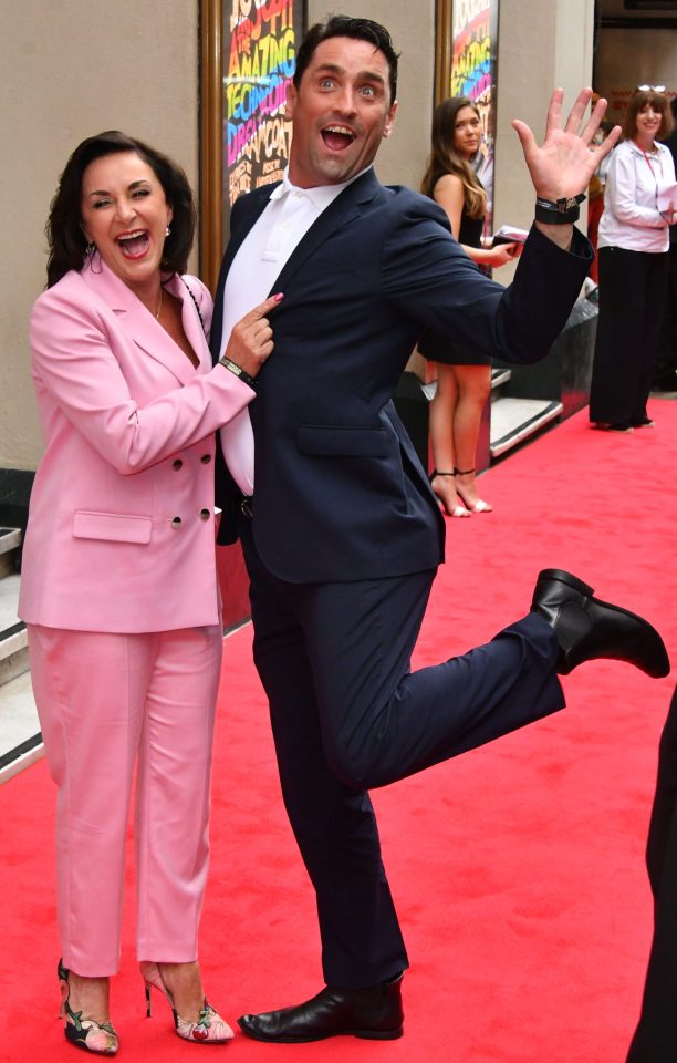  Shirley looked thrilled to be on the red carpet with her hunky toyboy