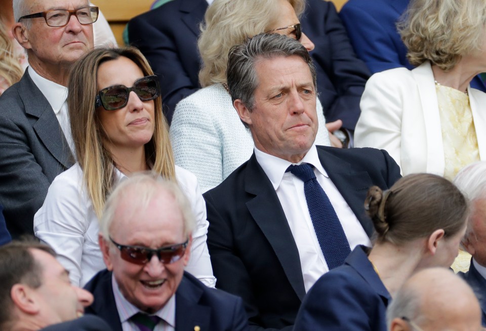  The actor and his wife appeared to be concentrating intently on the game