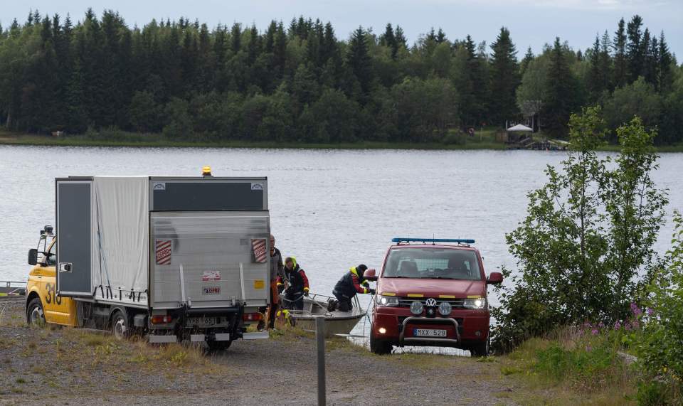 An emergency services boat carrying wreckage parts of the small airplane 