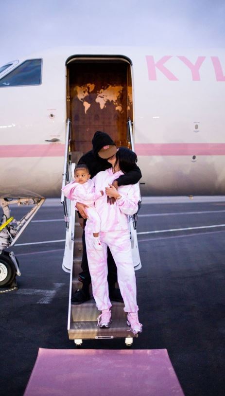 She boarded the private jet with her baby daddy Travis Scott and their daughter Stormi