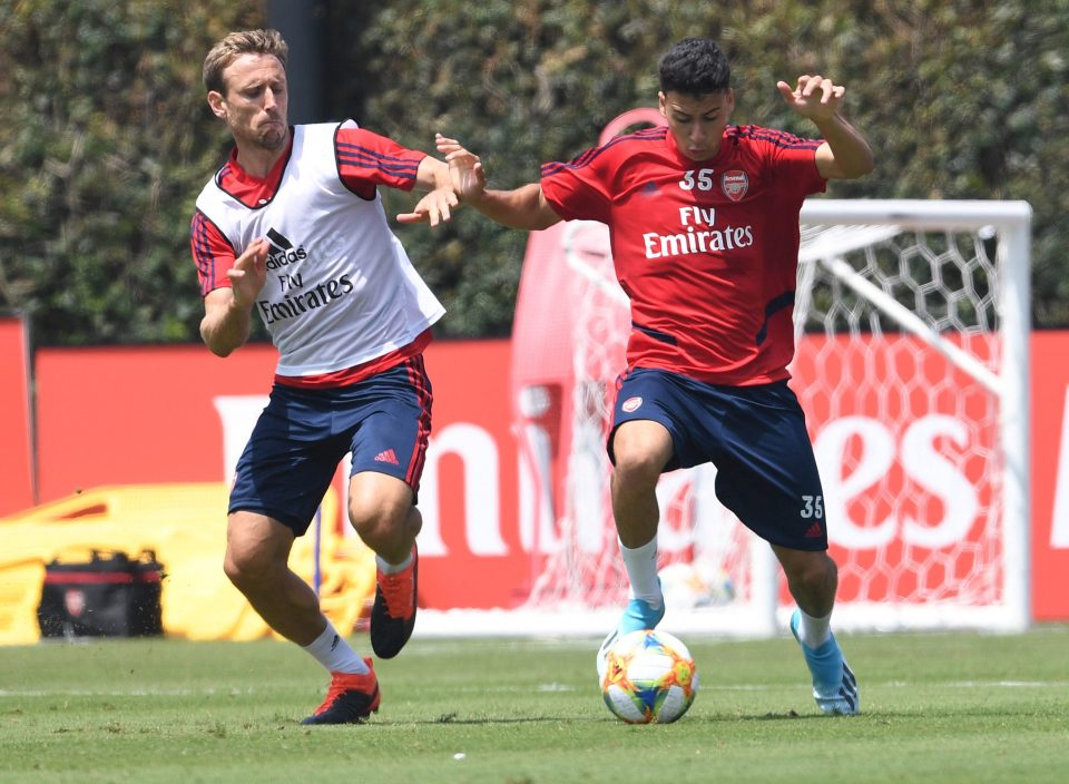 Gabriell Martinelli fends off Nacho Monreal at the university site in Los angeles