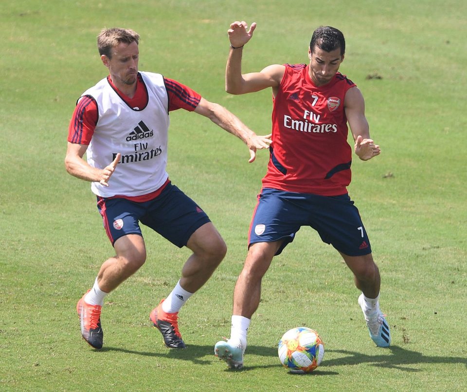 Full-back Nacho Monreal and wideman Henrikh Mkhitaryan battle away during training in LA