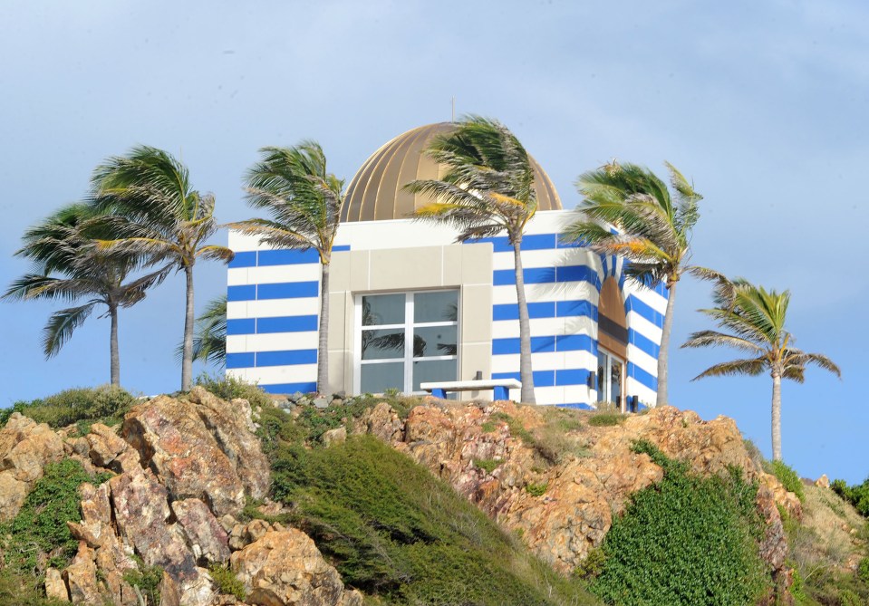  He transformed the island and built a mansion and a bizarre blue and white temple