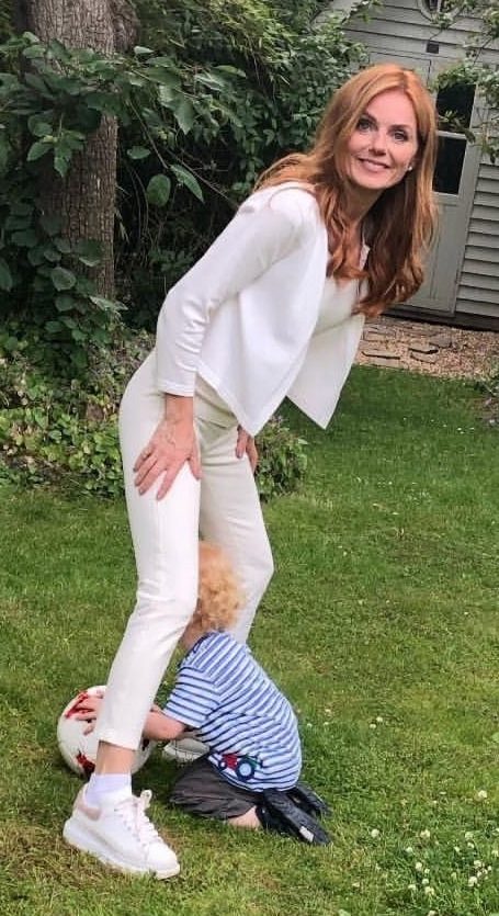 The Spice Girl wore a chic white outfit while playing with her son earlier this month