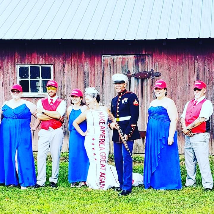  The couple posed with guns while the groomsmen and bridesmaids had themed outfits