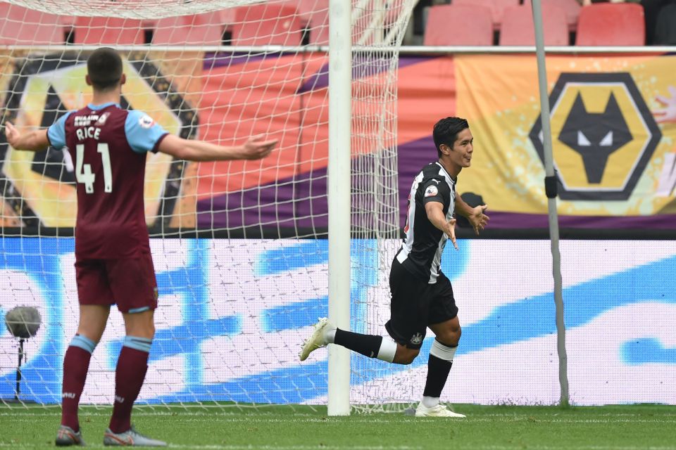 Yoshinori Muto celebrates after giving Newcastle the lead against West Ham