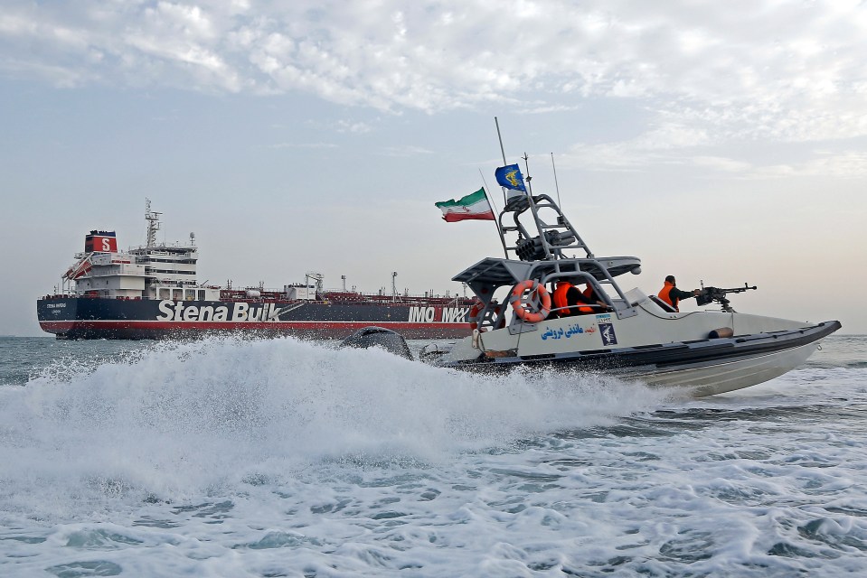  An Iranian Revolutionary Guard jet boat sails around the seized British-flagged tanker Stena Impero in Bandar Abbas