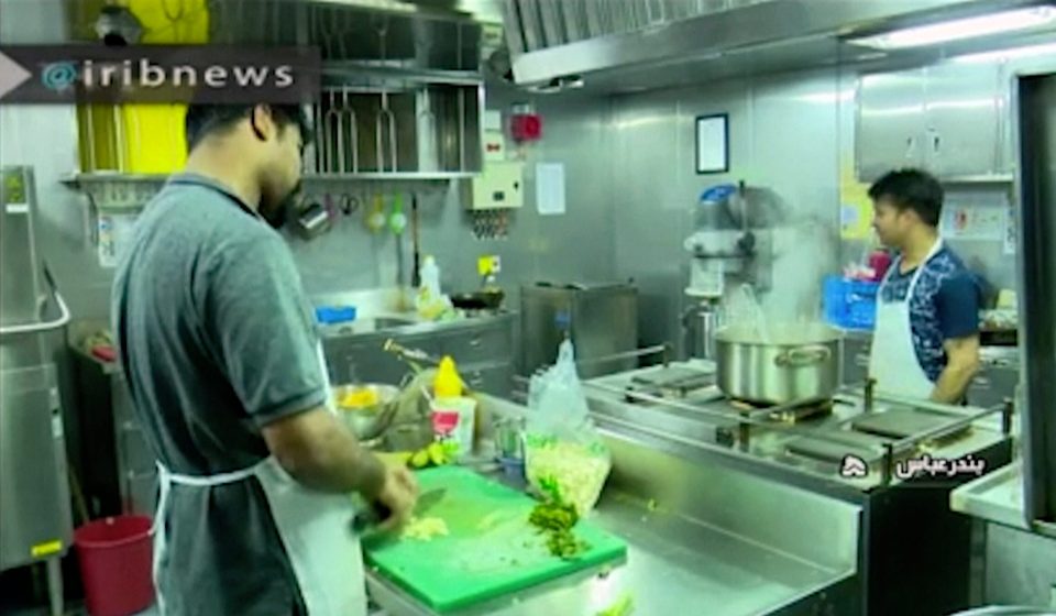  Some can be seen working in the ship's kitchen