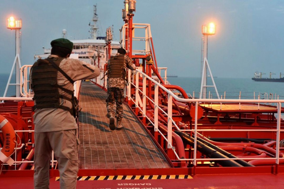  Armed members of the Revolutionary Guard patrol the ship on Sunday