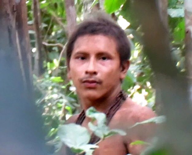 The bare-chested man in the remarkable video is understood to belong to the nomadic Awá people