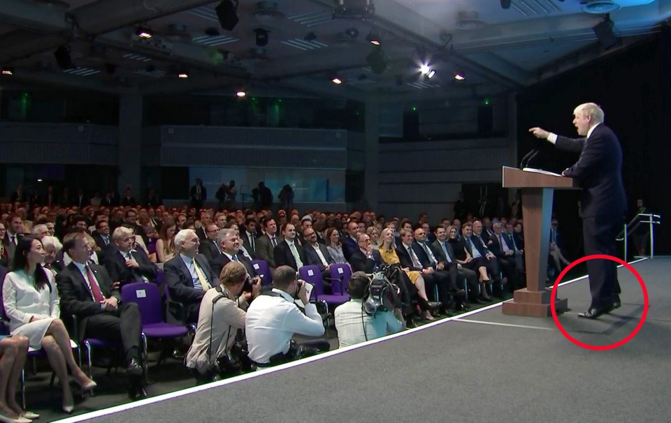  Mr Johnson stood on tiptoes as he addressed activists