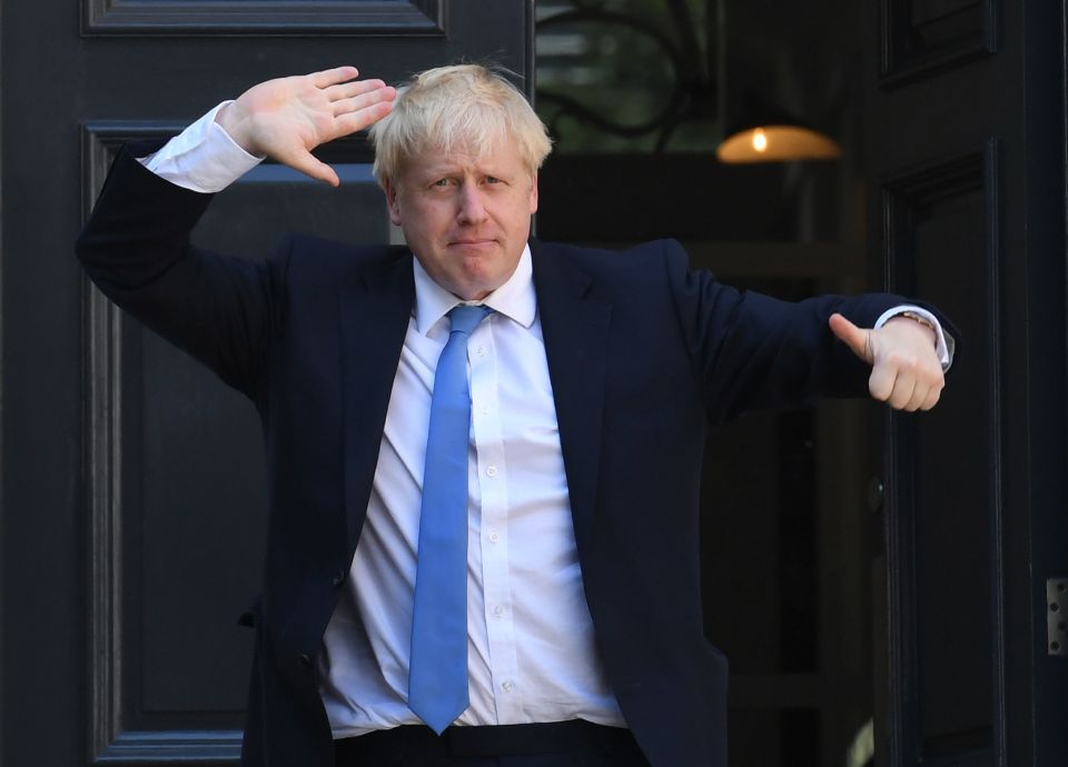  Mr Johnson pictured arriving at his HQ after winning the election