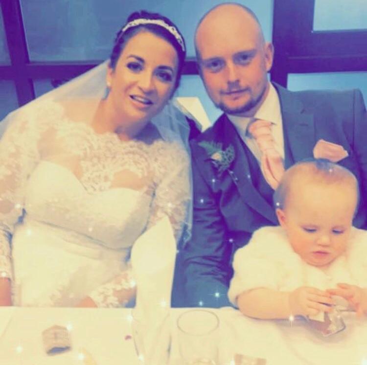  Saffron, who was unknowingly four months pregnant and Josh on their wedding day with baby Dorothy