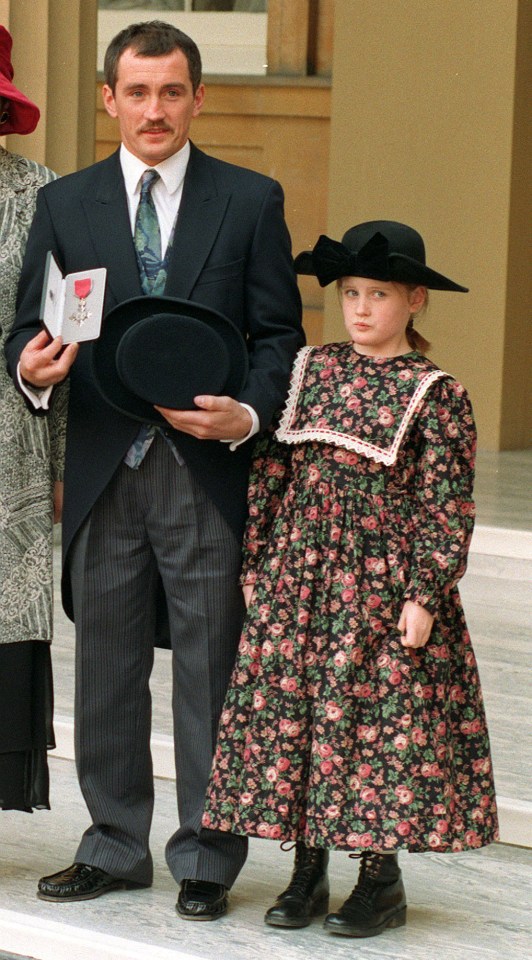  Danika pictured alongside her father at Buckingham Palace after he was presented with an MBE